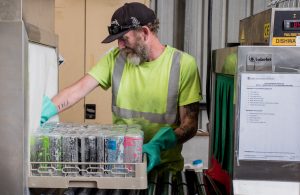 Man loading a dishwasher