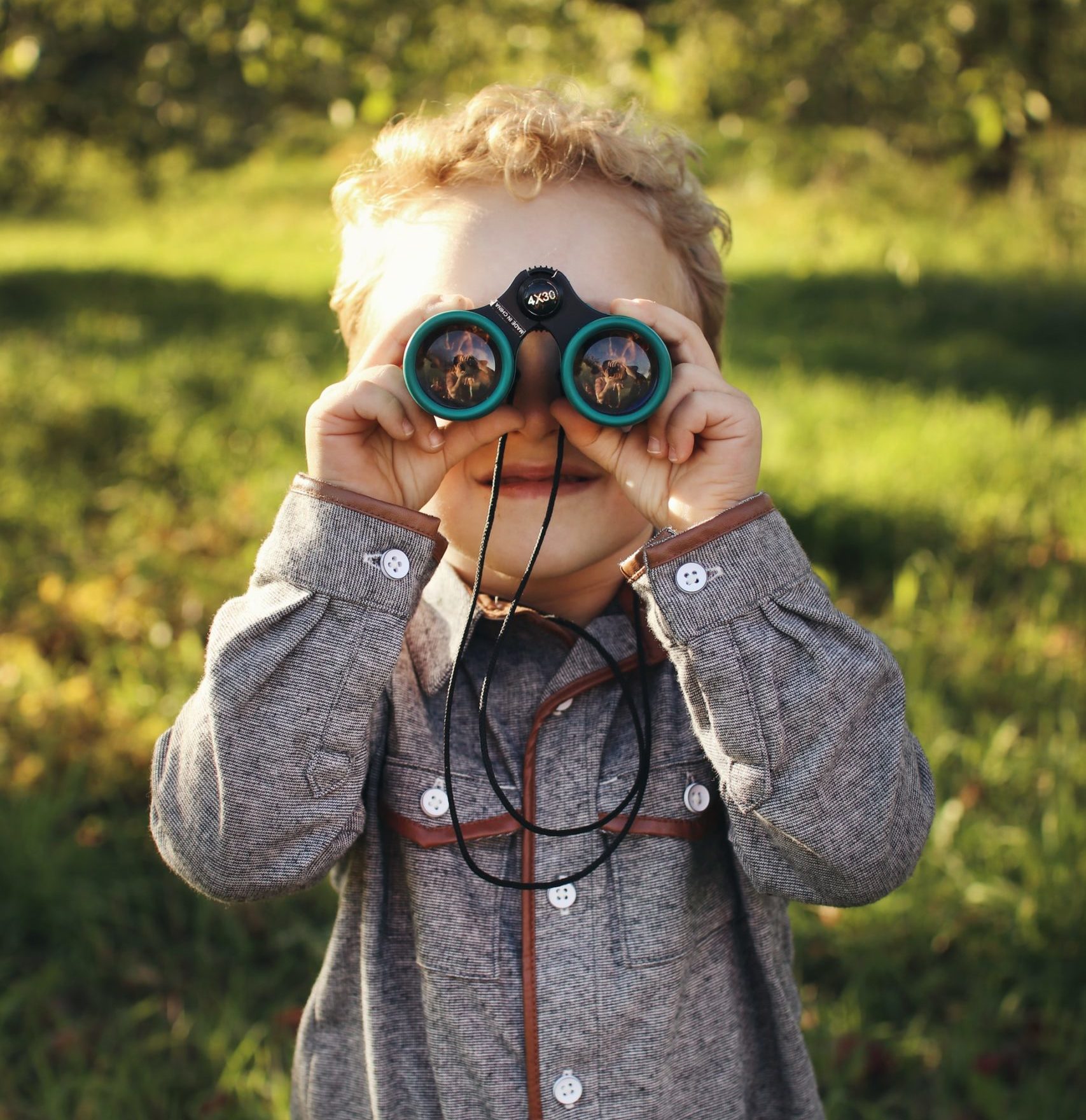 Boy with binoculars