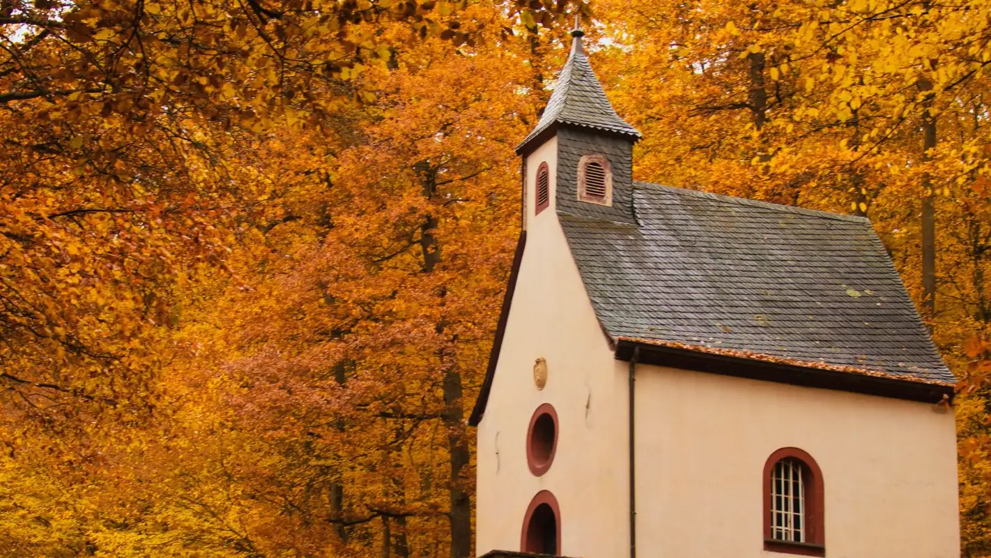 Old church with fall leaves